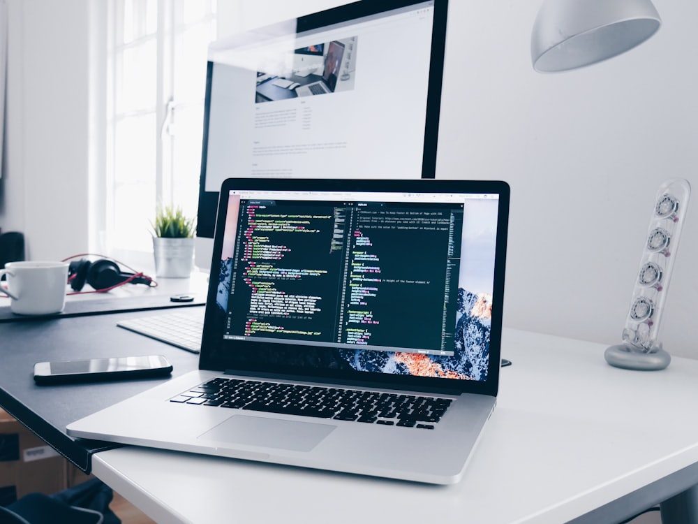 A developer's workstation with website code on screen